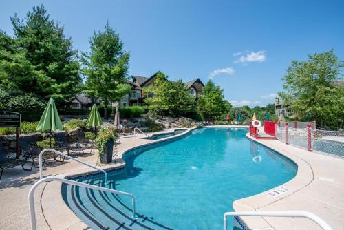 a swimming pool with a slide in a resort at Hawk Hill in Vernon Township