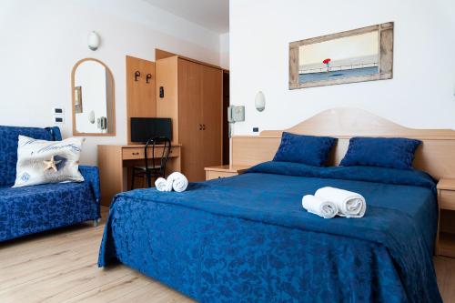 Postel nebo postele na pokoji v ubytování Hotel Mauritius Sentirsi come a Casa