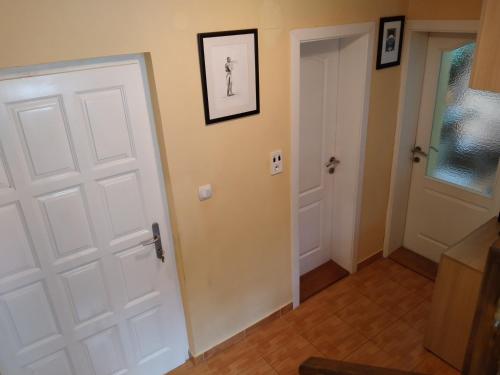 a room with a white door and a hallway at Prenoćište na Drini Foča in Foča