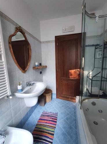 a bathroom with a sink and a toilet and a shower at A me ca picita in Stella