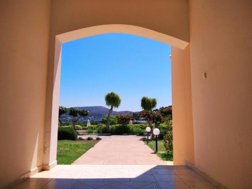 an archway leading into a building with a view at Hotel Marilen in Alinda
