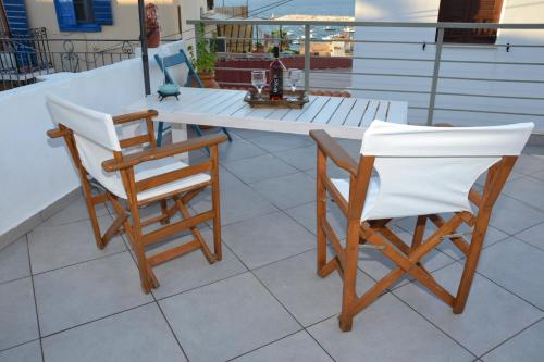 a table and two chairs sitting on a patio at FOTIS HOUSE in Koroni