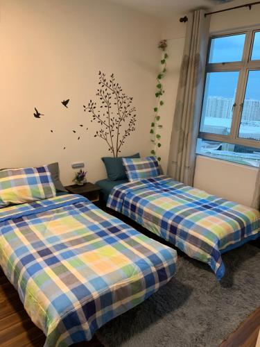 A bed or beds in a room at TR Penang House for Large Family Getaways