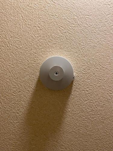 a metal object on the ceiling of a room at Hostel Furoya in Osaka