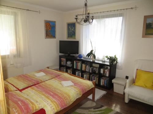 Postel nebo postele na pokoji v ubytování Vadvirág Apartman