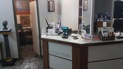 a reception desk in a room with at Hotel Minerva in Pordenone