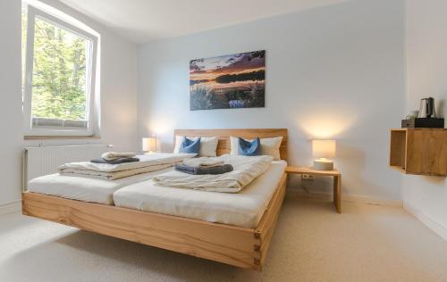 a bedroom with a bed with two pillows on it at Hotel Johnsburg in Uelzen