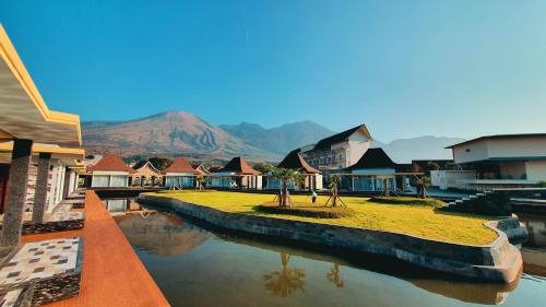 a group of buildings with mountains in the background at Cahaya Villa Garut in Garut