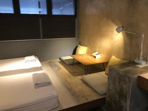 Ένα ή περισσότερα κρεβάτια σε δωμάτιο στο In a Box Hostel