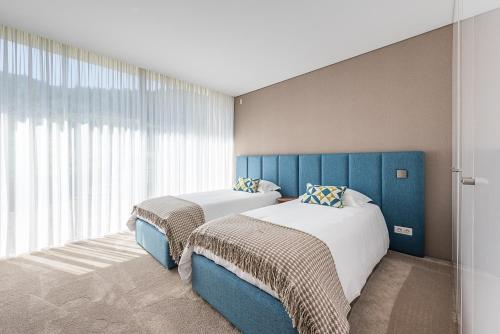 Un pat sau paturi într-o cameră la Casa D'Inês