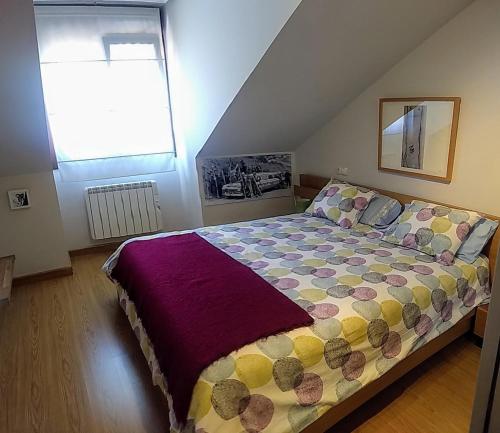 A bed or beds in a room at Los Molinos - Atico en Montaña de Asturias