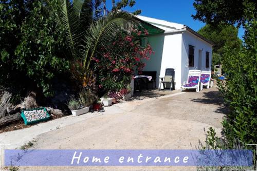a home entrance sign in front of a house at Near the sea vacation home Parja in Vis
