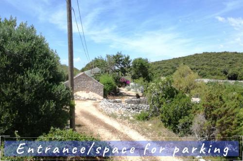 an entrancepacepace for parking sign in front of a house at Near the sea vacation home Parja in Vis