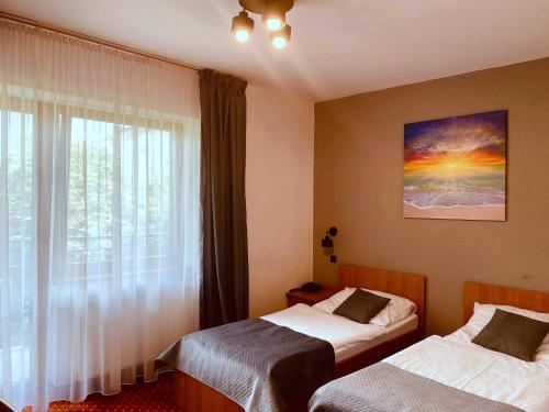 Cama o camas de una habitación en Hotel Solny
