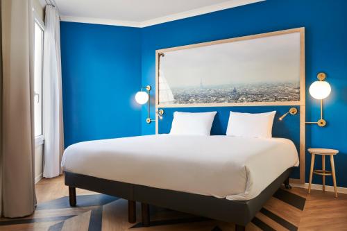Postel nebo postele na pokoji v ubytování Aparthotel Adagio Porte de Versailles