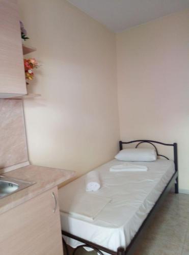 a small room with a small bed in the corner at House Lena in Sarti
