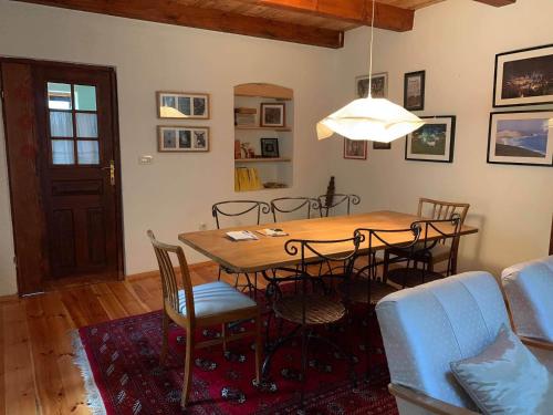 a dining room with a table and chairs at Holiday Home Luka 10 in Kalnik