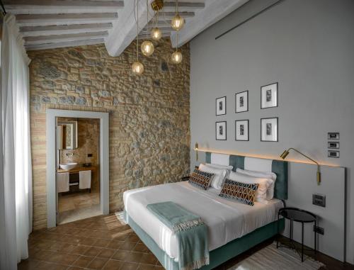 Ένα ή περισσότερα κρεβάτια σε δωμάτιο στο Locanda dei Logi
