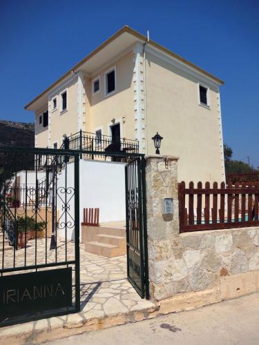 a building with a gate in front of it at Iriana Village Inn in Stavros