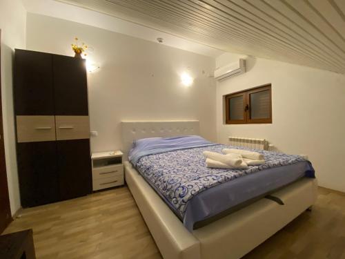 Postel nebo postele na pokoji v ubytování Apartments Family