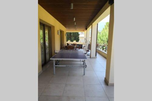 a patio with a ping pong table on it at Villa Tiziana in Monreale