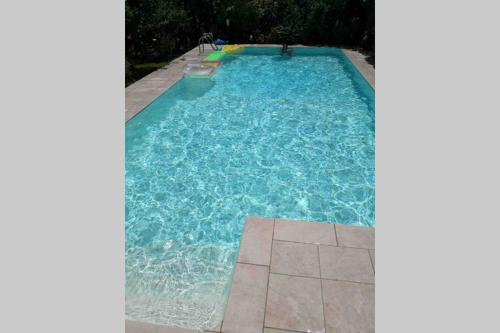 an image of a swimming pool with blue water at Villa Tiziana in Monreale