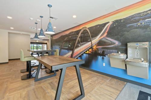 a dining room with a mural of a train at Extended Stay America Premier Suites - Austin - Austin Airport in Austin