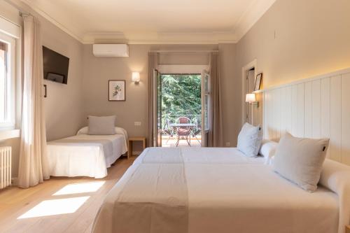 Postel nebo postele na pokoji v ubytování Hotel Artaza