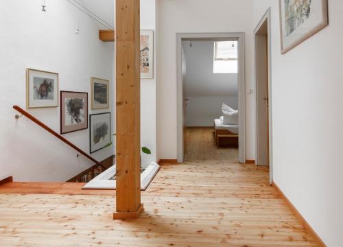 a hallway with a wooden floor in a room at Ferienwohnung am Bründlweg in Golling an der Salzach