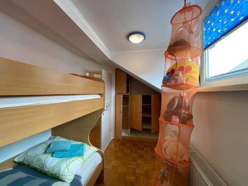 a small room with two bunk beds and a window at Apartment Kranj - huge terrace, free P, WI - FI, AC in Kranj