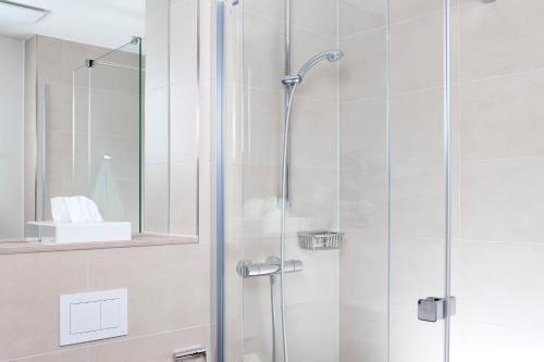 Koupelna v ubytování Hotel Alpha