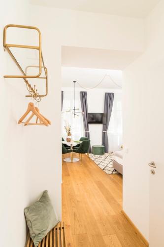 a living room with a couch and a table at Mint@Naschmarkt Premium Apartments in Vienna