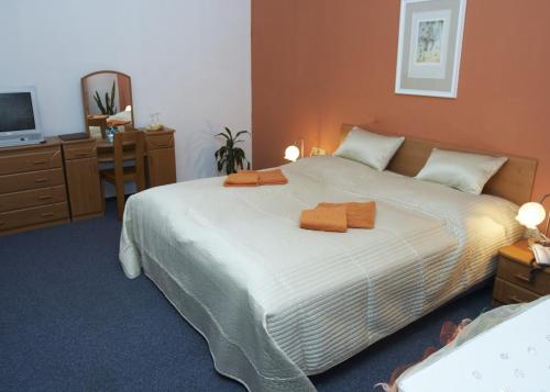 Postel nebo postele na pokoji v ubytování Hotel Maria