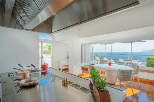 a kitchen with a view of the ocean at Casa Angelina in Praiano
