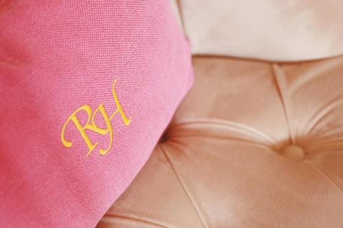 a close up of a pink napkin with the word nap on it at Renaissancehotel Raffelsberger Hof B&B in Weissenkirchen in der Wachau