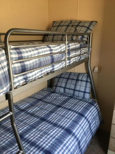 a couple of bunk beds in a room at G17 The Chase , Ingoldmells, Skegness in Ingoldmells