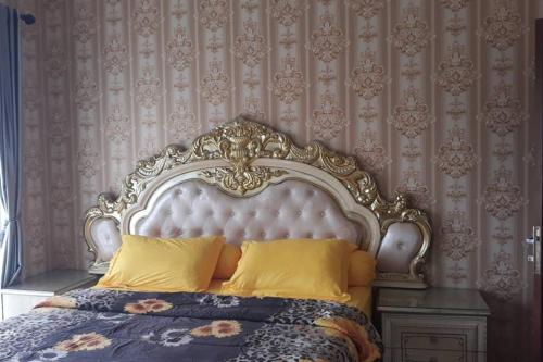En eller flere senge i et værelse på Villa faugi