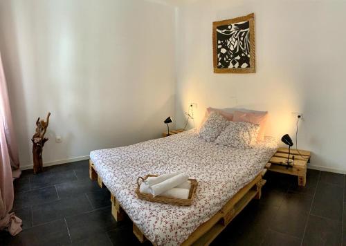 a bedroom with a bed with a basket on it at Workation - La Casita de Elsi y Fran in Costa Calma
