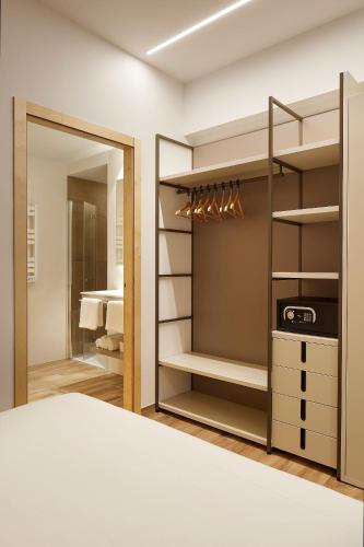 a bedroom with a bed and a closet at Apartamentos Isaga in Zarautz