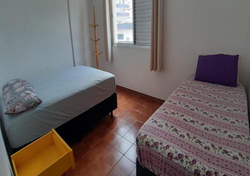 En eller flere senger på et rom på Apartamento Praia Grande- SP Vila Tupi