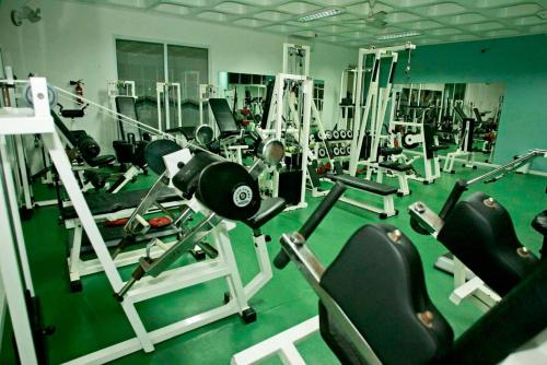 a gym with lots of equipment in a room at QH Praia de Quiaios in Praia de Quiaios