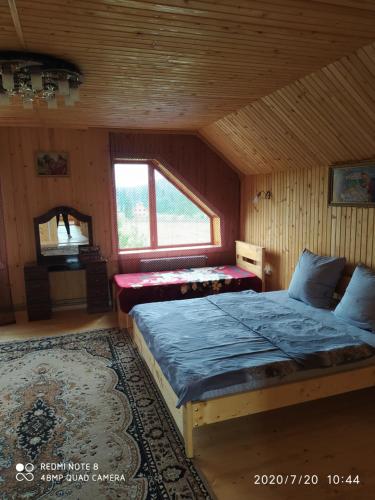 A bed or beds in a room at Під Явором