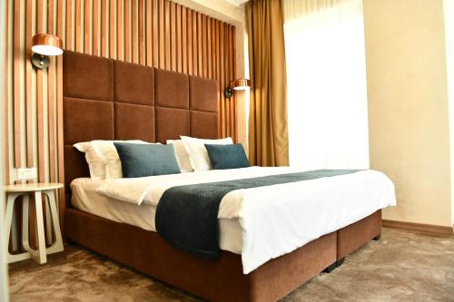 Ένα ή περισσότερα κρεβάτια σε δωμάτιο στο Quartz Boutique Hotel