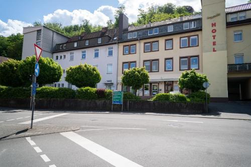 an empty street in front of a building at Beautiful Apartment in town centre (TLA/TDY/TLF) in Landstuhl