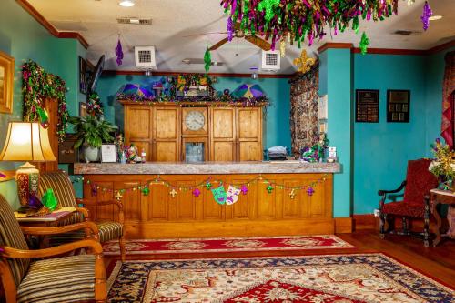 a bar in a room with blue walls at Hotel de la Monnaie, French Quarter in New Orleans