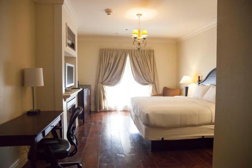 a hotel room with a bed and a window at Niagara Crossing Hotel and Spa in Lewiston