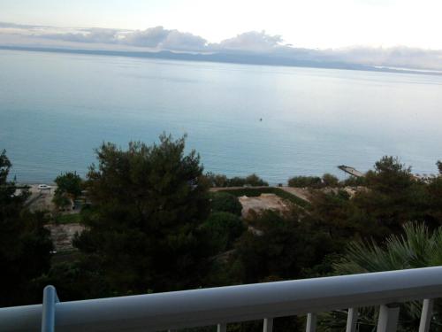 a view of the ocean from a balcony at Drenos Rooms view in Kallithea Halkidikis