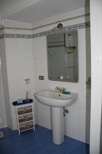 a bathroom with a sink and a mirror at Terrazza in borgo San Jacopo in Florence