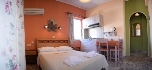 A bed or beds in a room at Stamoulis Apartments