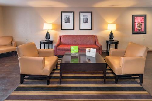 a living room with a couch and two chairs at Extended Stay America Suites - Houston - Northwest - Hwy 290 - Hollister in Houston